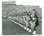 Line of Scottish Highlander drummers at Kinnick Stadium, The University of Iowa, 1960s