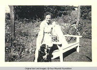 Irene at table with dogs