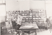 010. Man reading the newspaper at the Fairfield, Iowa Public Library in 1939