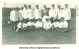 Students in white caps and jackets with pointed canes for Senior Frolic, The University of Iowa, 1910s