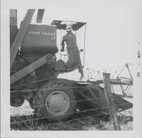 V. Burger combining beans on R. Smith's farm.