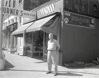 Man stands in front of feed store