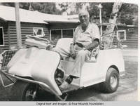 Bill Burden in golfcart