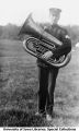 Military band member with French horn, The University of Iowa, 1914