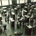 Dental students working with patients in a large clinic, The University of Iowa, 1940s