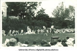Women dressed as flowers dancing on lawn for celebration, The University of Iowa, 1920s?