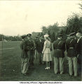 Officers talking on a field near University Hospitals, The University of Iowa, 1950s