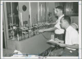 Dr. George T. Tsao and a graduate student testing moisture absorption of F.T. starch