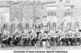 Rifle team with four trophies, The University of Iowa, 1931