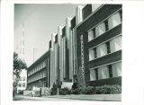 Student leaving the south entrance of the Main Library, the University of Iowa, circa 1955