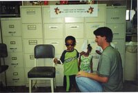 2000 - Chris Hogge with children at J.B.Martin party