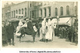 Costumed men on horses in parade, The University of Iowa, between 1910 and 1920