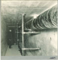 Designer B.P. Fleming inside the tunnel under the dam, The University of Iowa, April 1927