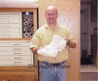 Staff holding doughnuts