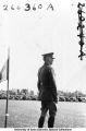 Governor's Day ceremony, officer observing the field, The University of Iowa, 1933