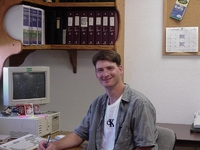 2000  Coop employee Chris Hogge works in the office