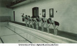 Students preparing to dive into a swimming pool, The University of Iowa, 1930s