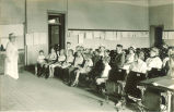 Children and adults in classroom, The University of Iowa, ca. 1920