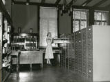 Dorothy Kehlenbeck looking at files, 1954