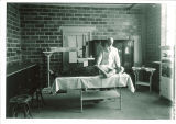 Doctor examining a student at the Field House, the University of Iowa, circa 1928