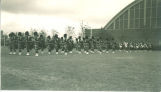 Scottish Highlanders in formation on west side of Armory, The University of Iowa, 1930s