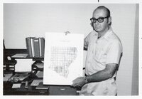 1975 Soil scientist Mel Brown man holds county oil survey map