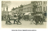 Crowd gathered on Clinton Street for Mecca Day parade, The University of Iowa, 1919