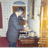 John, Sr. carving the turkey in dinning room
