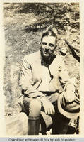 Bill Burden sitting on log