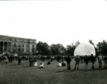 A hot air balloon being filled with air during the Homecoming Pep Rally on Central Campus, 1977