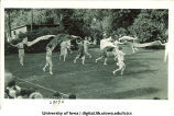 Women in costume dancing outside with large scarves, The University of Iowa, June 1924