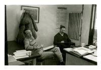Two Men Around a Desk