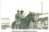 Bugle boys in blackface on horse in Mecca Day parade, The University of Iowa, 1920