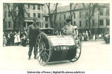 Mechanical engineers and perpetual motion machine in Mecca Day parade, The University of Iowa, 1920s