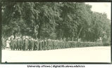 Commencement procession walking south on Clinton Street and turning west towards Old Capitol, The University of Iowa, June 6, 1922