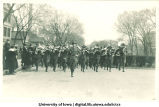 Military marching band in Mecca Day parade, The University of Iowa, 1921