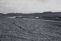 Mud Soaked Field with stream at one end