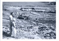 Clyde Small and son viewing pond construction, 1966