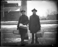 UP478 Two travelers with luggage