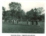 Playing a game outside with a rolling ball, The University of Iowa, 1937