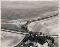 Farmland and buildings with "Rollo there" spelled out in field