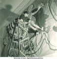 Student assembling modern art mural, The University of Iowa, March 1940