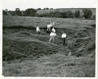 1948  Six Men Stand in Gullied Field