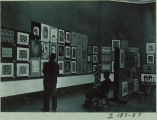 Perusing an exhibition in the Art Building, the University of Iowa, 1936