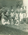 School children gathered outside with teacher, The University of Iowa, 1925