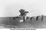 Cadets at camp filling straw mattresses, The University of Iowa, 1912