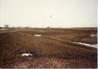 Melting snow on Construction site where pond is being built on Frank Johnson's farm