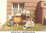 Group of students next to sign for Halsey Gymnasium, The University of Iowa, 1970s