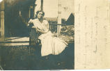 Young woman on day bed in front of house, Milton, Iowa, August 24, 1907