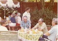Gene Francis and Verle Arnold in Center at Party